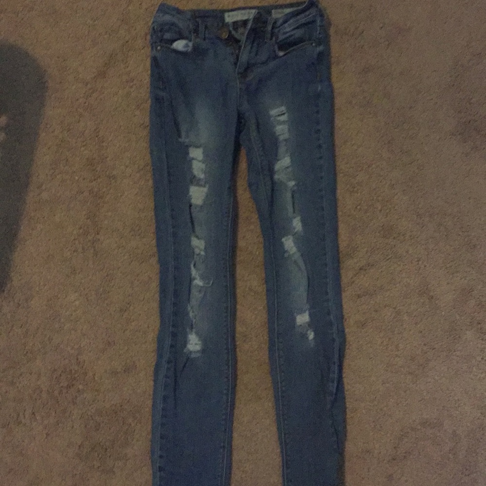 Real jeans with lots of holes